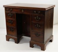 GEORGE III MAHOGANY KNEEHOLE DESK / CARD TABLE, moulded foldover top fitted with baize, above