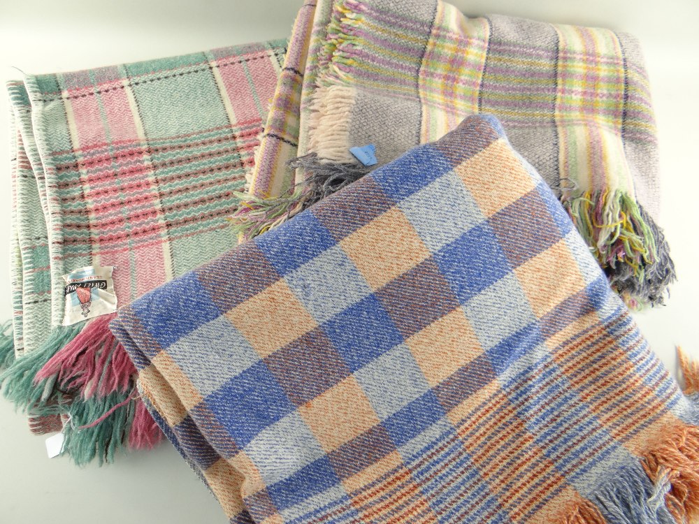THREE VINTAGE FRINGED WOOLEN BLANKETS comprising pink and green labelled Gwili Mills of