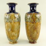 PAIR DOULTON LAMBETH STONEWARE VASES, slender oviform with art nouveau style foliate decoration to