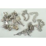 ASSORTED SILVER BRACELETS comprising two silver charm bracelets with various charms and three silver