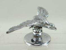 EAGLE CAR MASCOT, by Desmo, with wings spread and orb in talons, 17.5cm wide, on circular mount