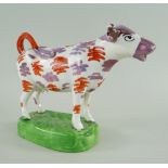 SWANSEA CAMBRIAN POTTERY COW CREAMER, iron red and pink lustre splashed decoration with black detail