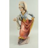 EUROPEAN CARVED FRUITWOOD, GESSO & POLYCHROME FIGURE OF A MAIDEN, dressed in medieval costume with