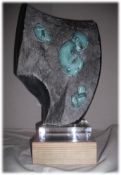 GLENN MORRIS bronze with African springstone on glass base, signed by artist Entitled 'Fossils' H=