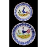 PAIR OF LLANELLY COCKEREL PLATES typically decorated with sponged floral motifs to the border,