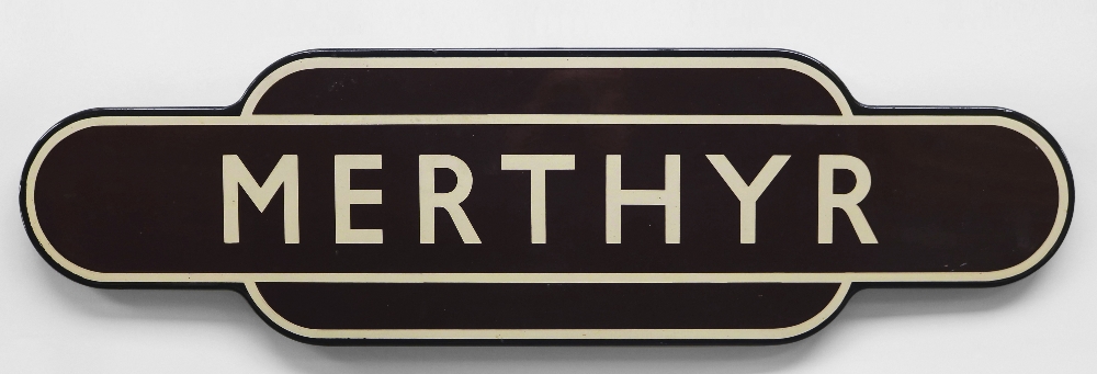 A BRITISH RAIL'TOTEM' ENAMEL SIGN FOR MERTHYR TYDFIL in typical brown, cream and black livery, of
