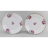 A PAIR OF NANTGARW PORCELAIN PLATES of circular form, finely painted with four sprigs of pink open