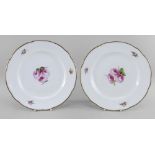 A PAIR OF NANTGARW PORCELAIN PLATES of lobed form, both painted with open pink roses and foliage,