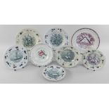 EIGHT YNYSMEUDWY POTTERY CHILDREN'S PLATES all with floral moulded borders, comprising two from a