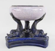 A RARE SWANSEA EARTHENWARE DOLPHIN-SUPPORT PASTILLE BURNER on curved triangular base, the base and