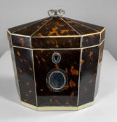 GEORGE III IVORY & SILVER MOUNTED TORTOISESHELL TEA CADDY, c. 1800, of oval 10-sided form, hinged