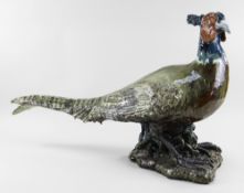 COLIN KELLAM (b.1942) large stoneware sculpture - pheasant standing on a rocky base with glass eyes,