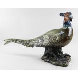 COLIN KELLAM (b.1942) large stoneware sculpture - pheasant standing on a rocky base with glass eyes,