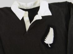 A 1950 NEW ZEALAND ALL BLACKS RUGBY UNION TEST JERSEY with embroidered silver fern to felt badge,