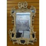 ANTIQUE ROCOCO-REVIVAL WALL MIRROR, overpainted with marginal mirrors to the corners, 116 x 80cms