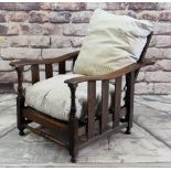 ARTS AND CRAFTS OAK LIBRARY CHAIR, slatted sides and reclining back, turned front supports, striped