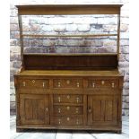 18TH CENTURY NORTH WALES OAK DRESSER, open delft rack above base fitted with six drawers and two