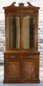 EDWARDIAN WALNUT BOOKCASE, carved cornice, door tops and cupboards, base with two frieze drawers