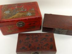 THREE CHINESE LACQUERED RED DOCUMENT BOXES, all with variously decorated tops and/or sides, metal