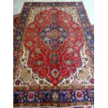 TABRIZ RUG, indigo medallion with pendants on a red floral field, ivory willow tree spandrels,