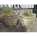 PAIR COMPOSITION STONE CIRCULAR PLANTERS, with moulded fruiting vine decoration, 37cms high (2)