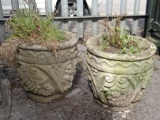 PAIR COMPOSITION STONE CIRCULAR PLANTERS, with moulded fruiting vine decoration, 37cms high (2)