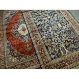 TWO MODERN ORIENTAL SIMULATED SILK RUGS, one a tree of life design in ivory and indigo, 232 x