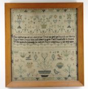 GEORGE III NEEDLEWORK SAMPLER, by Maria Neep, aged 10, 1818, decorated with stylised flowers,