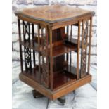EDWARDIAN ROSEWOOD MARQUETRY REVOLVING BOOKCASE, shaped top with checkered edge, open shelves with