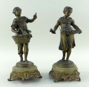 PAIR OF FRENCH PATINATED BRONZE FIGURES OF PEASANT YOUTHS, with fruit and flower baskets, on onyx