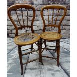 NEAR PAIR VICTORIAN BEECH CHILDRENS' CORRECTIONAL CHAIRS, balloon back and spindle splats, rattan