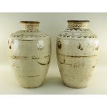 TWO CHINESE CIZHOU STONEWARE JARS, cream slip glazed with brown painted decoration, 50cms high (2)