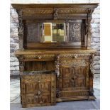 FLEMISH RENAISSANCE-STYLE CARVED OAK CABINET, architectural mirror back top with male and female