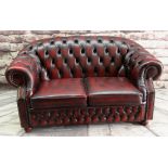 MODERN VICTORIAN-STYLE BURGUNDY LEATHER SETTEE, button upholstered and close-nailed, bun feet,