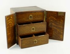 EDWARDIAN OAK THREE-DRAWER TABLE CABINET, fitted deep drawers with flush handles, similar side