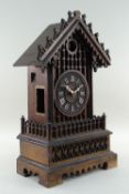BLACK FOREST MANTEL CUCKOO CLOCK, of 'Chalet' form, with applied Roman numerals and bone hands,