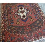 BAKHTIAR RUG, pointed ivory medallion on a soft red and sage green field, cherry border and ivory