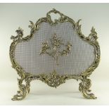 LOUIS XV-STYLE ROCOCO REVIVAL BRASS FIRE SCREEN, later mesh applied with brass cupids flaming a
