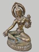 SINO-TIBETAN BRASS FIGURE OF TARA, seated in lalitasana, both hands held in vitarkamudra, the left