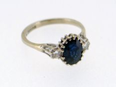 18CT WHITE GOLD SAPPHIRE & DIAMOND RING, the central sapphire (7 x 6mms) flanked by two diamonds,