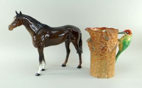 LARGE BESWICK MODEL OF A HORSE and FALCONWARE WOODPECKER JUG, horse 28.5cm high, jug by J.H.