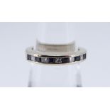 18CT WHITE GOLD ELEVEN STONE DIAMOND & SAPPHIRE RING, ring size K, 4.9gms, in black square ring