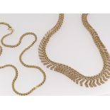 TWO 9K GOLD NECKLACES, one a fringe necklace with graduated brick and Z-links, 25.6g, and an S-