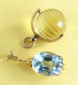 9CT GOLD REVOLVING FOB pale yellow gem possibly a citrine together with yellow metal set pendant