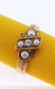 18CT GOLD PEARL & DIAMOND RING of scroll and cross design having a central diamond (0.05cts approx.)