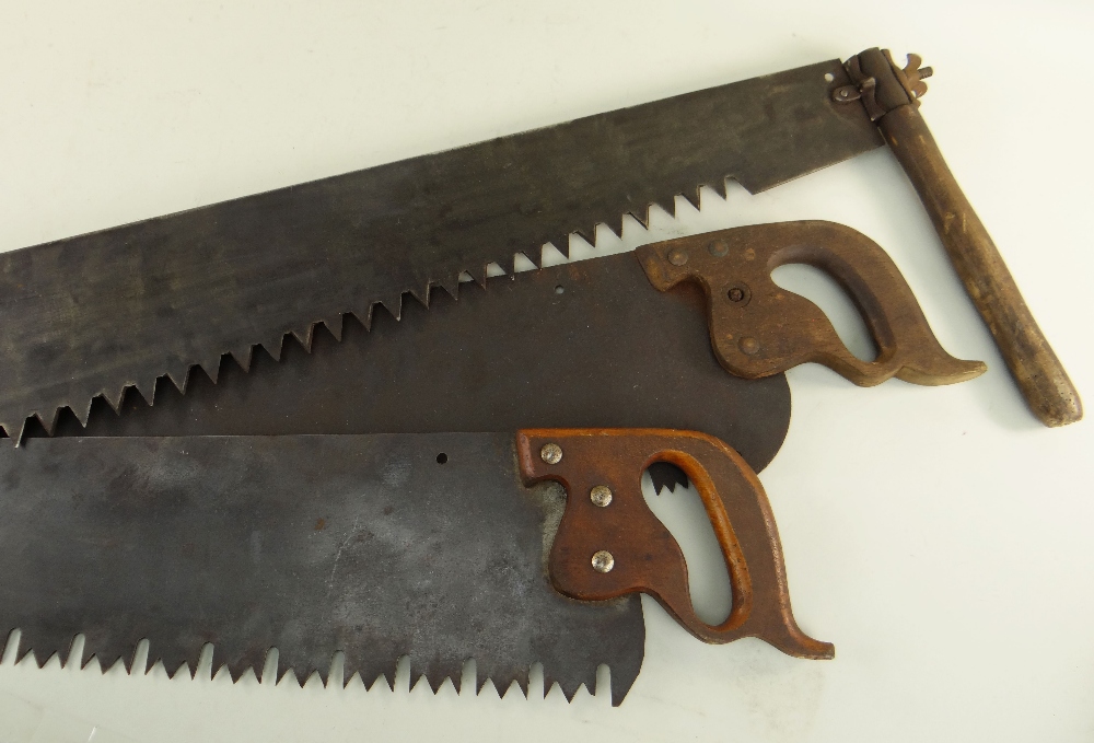 THREE VINTAGE TWO MAN CROSS CUT SAWS, largest 178cm long (3) Condition, one lacks turned handle,