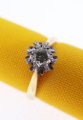 18CT GOLD DIAMOND ILLUSION SET RING, the central stone 0.1cts approx., ring size K, 3.4gms, in black