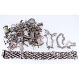 ASSORTED SILVER JEWELLERY comprising charm bracelet with multiple and various charms, chunky