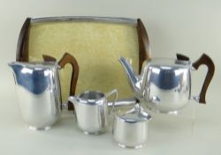 STYLISH 1950s 'NEWMAID' POLISHED ALUMINIUM FOUR-PIECE TEA SET, with stained wood handles, and a