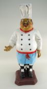 VINTAGE ADVERTISING FIGURE OF A MERRY CHEF, wearing wire spectacles, on plinth base, fibreglass,